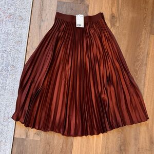 Never worn, with tags burgundy silk H&M pleated skirt